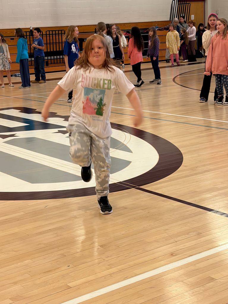 students dancing in the gym