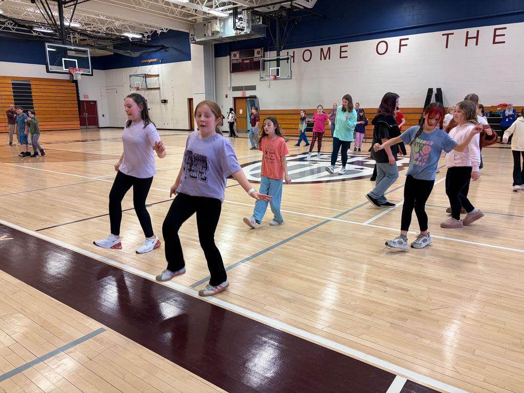 students dancing in the gym