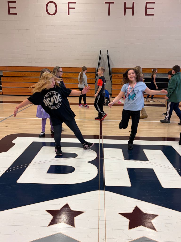 students dancing in the gym