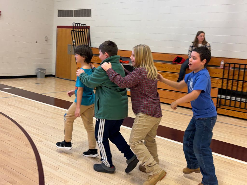 students dancing in the gym