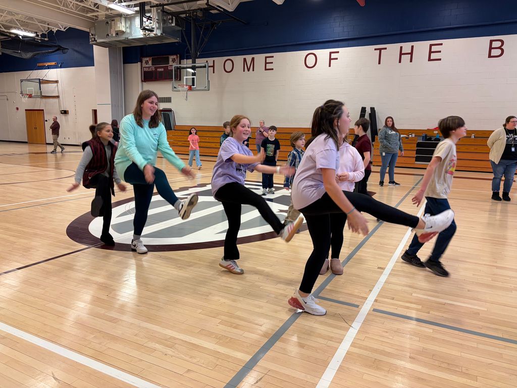 students dancing in the gym