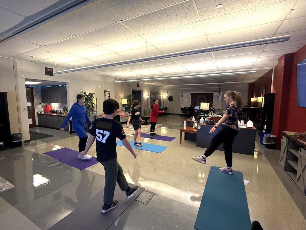 Students practicing leg swings as we learn about utilizing dynamic stretching before physical fitness. 