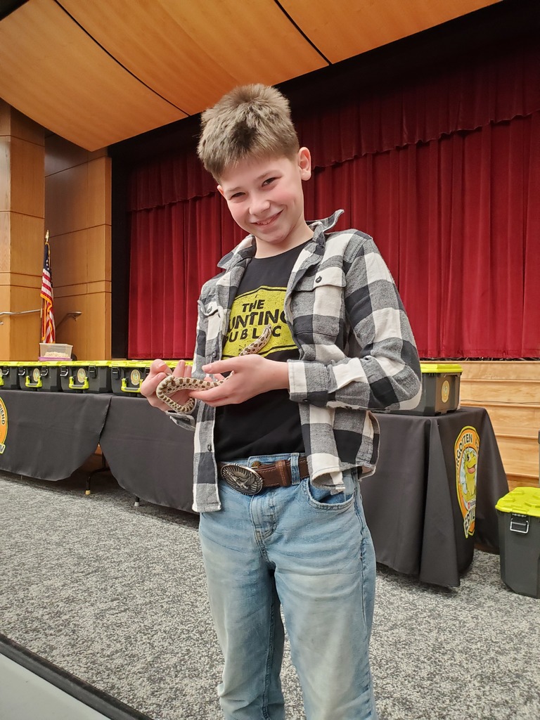 student holding a snake