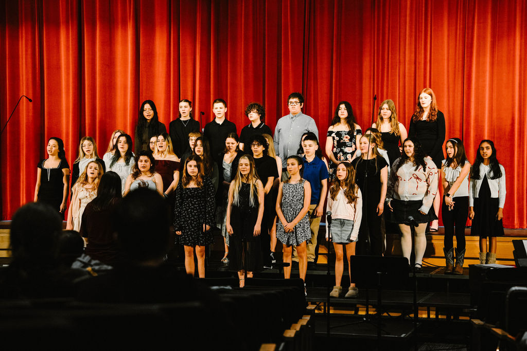 Middle School Chorus performing at MIOS
