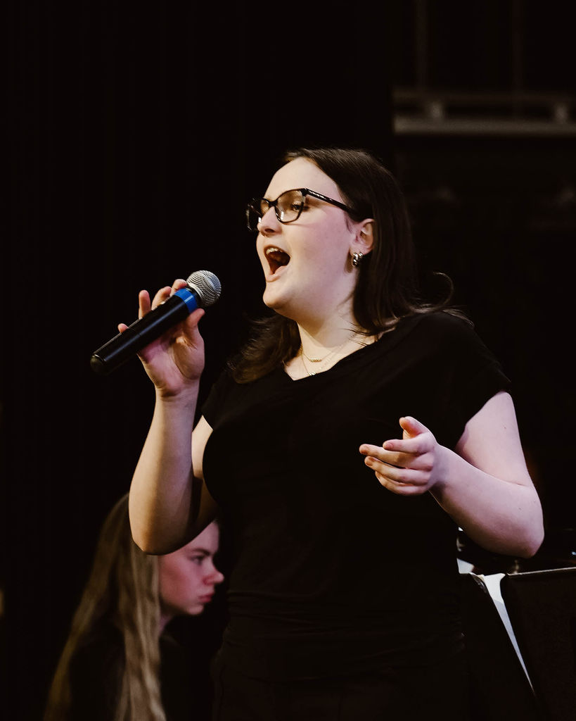 Student singing a solo at MIOS