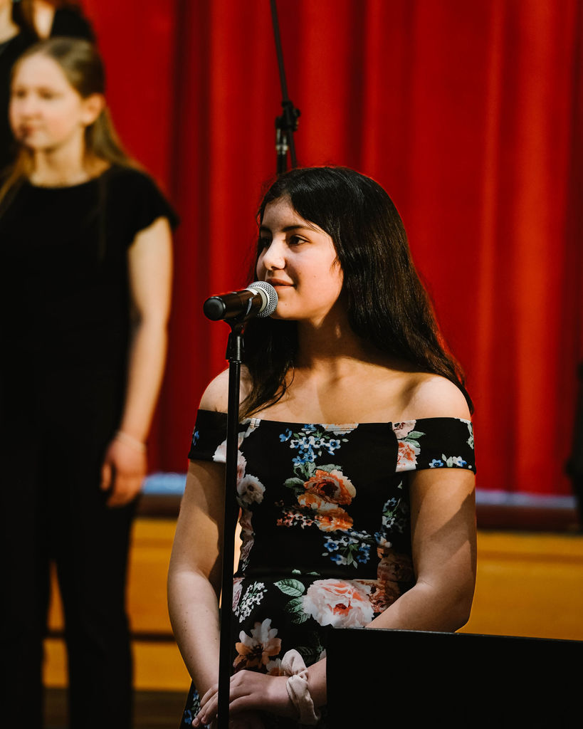 Student singing a solo at MIOS