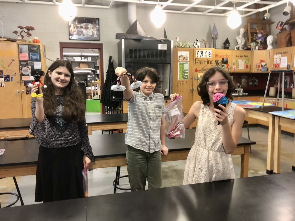 Students displaying their final creations.