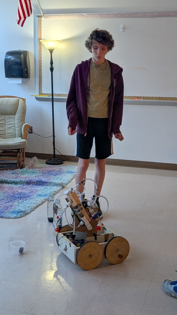 student next to robot