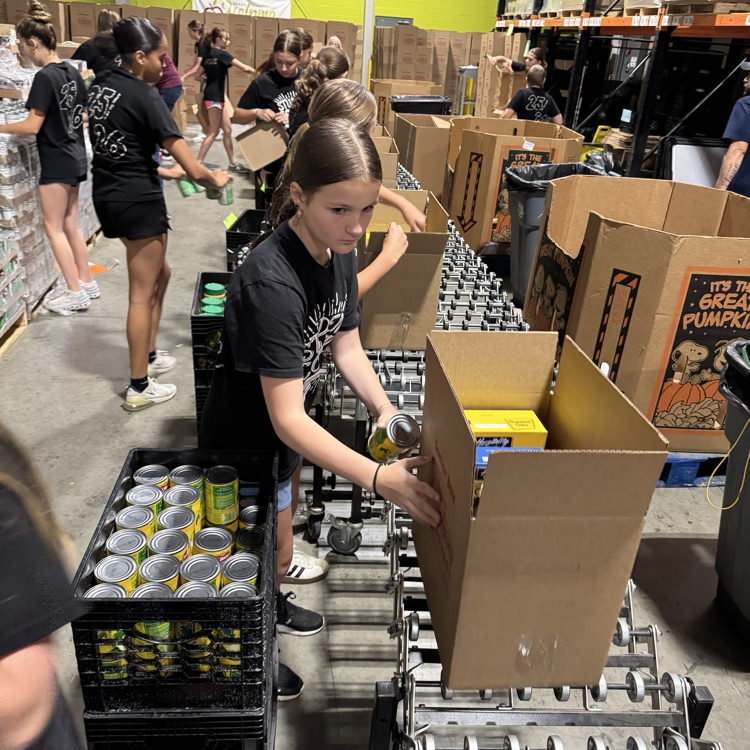 MS Student Council/Key Club packing senior boxes at helping harvest food bank.