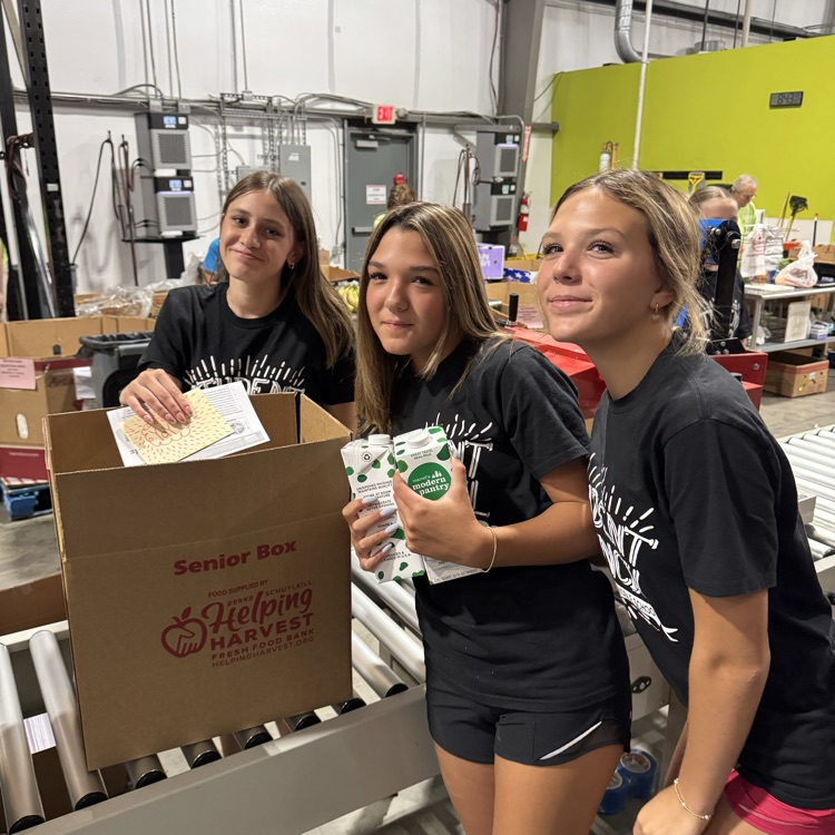 MS Student Council/Key Club packing senior boxes at helping harvest food bank.