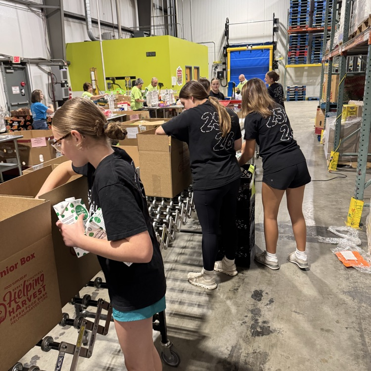 MS Student Council/Key Club packing senior boxes at helping harvest food bank.