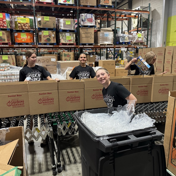 MS Student Council/Key Club packing senior boxes at helping harvest food bank.