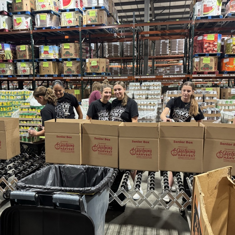 MS Student Council/Key Club packing senior boxes at helping harvest food bank.