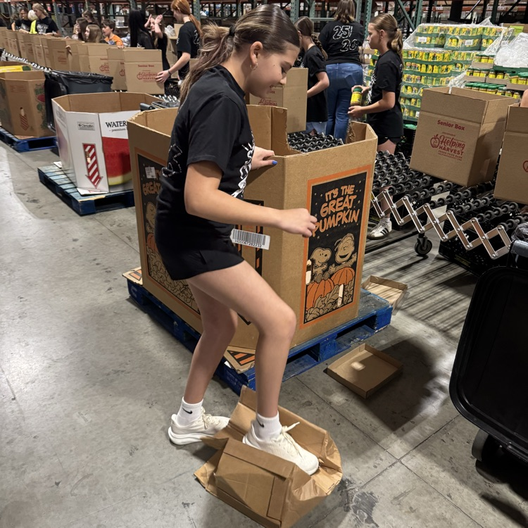 MS Student Council/Key Club packing senior boxes at helping harvest food bank.