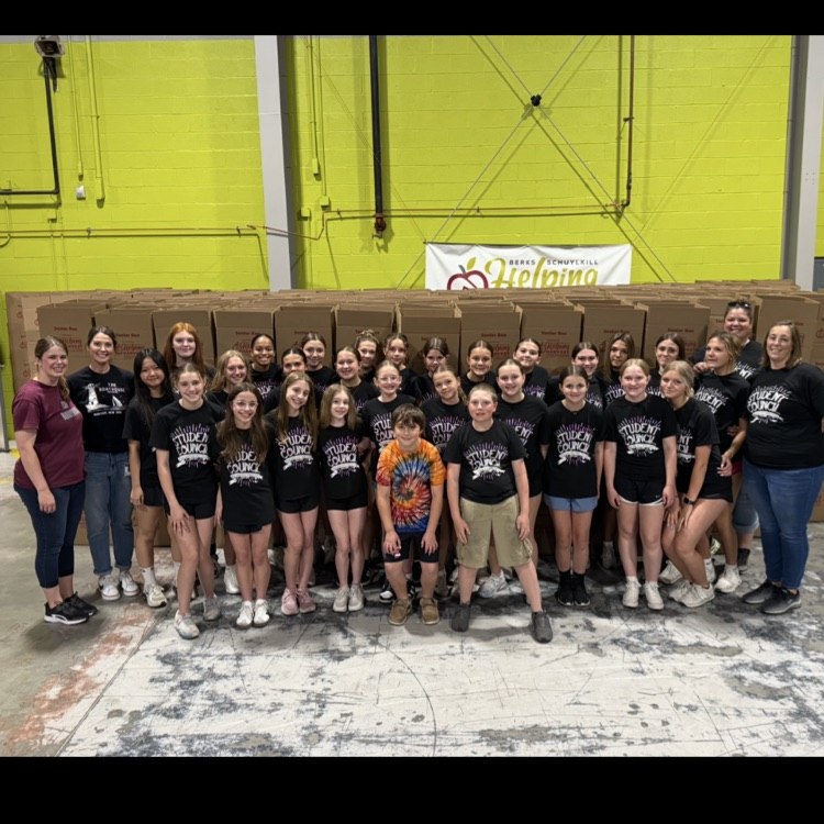 MS Student Council/Key Club packing senior boxes at helping harvest food bank.