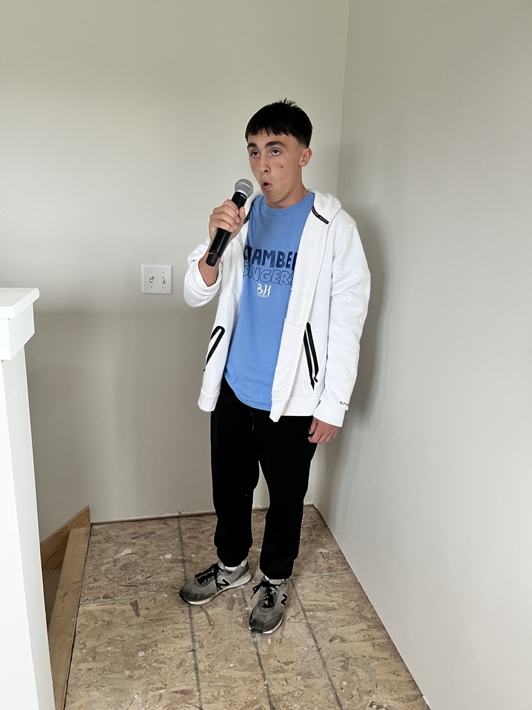 Student singing the National Anthem
