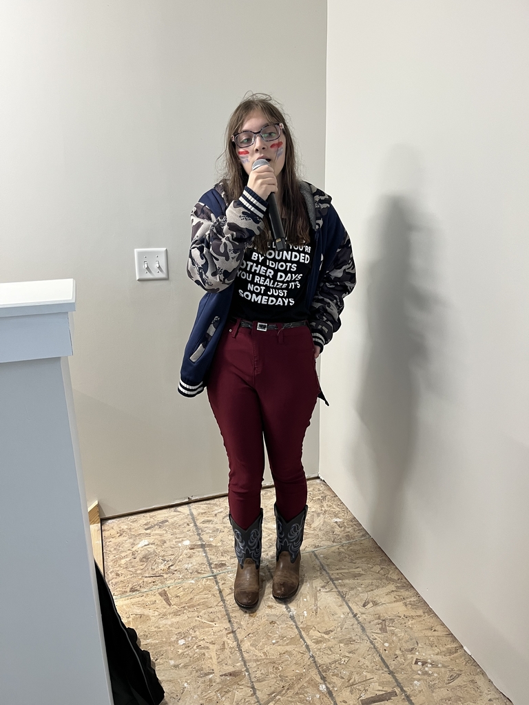 Student singing the National Anthem