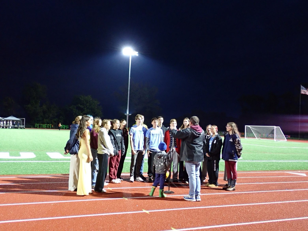 Chamber Singers performing the Natonal Anthem on the track