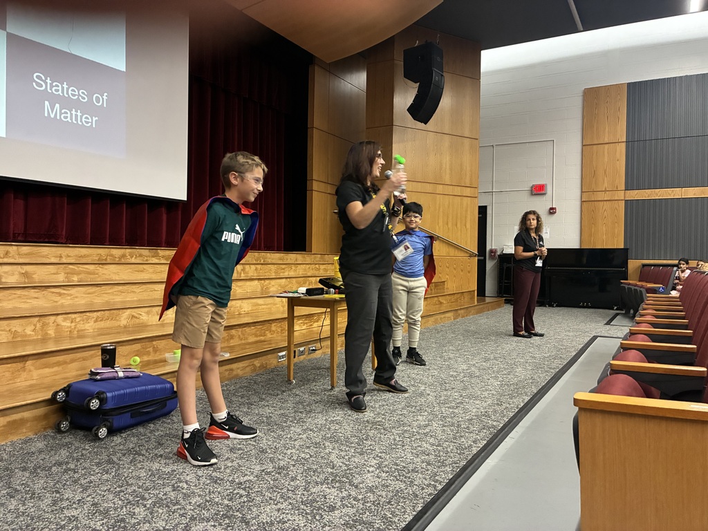 people standing at the front of the auditorium