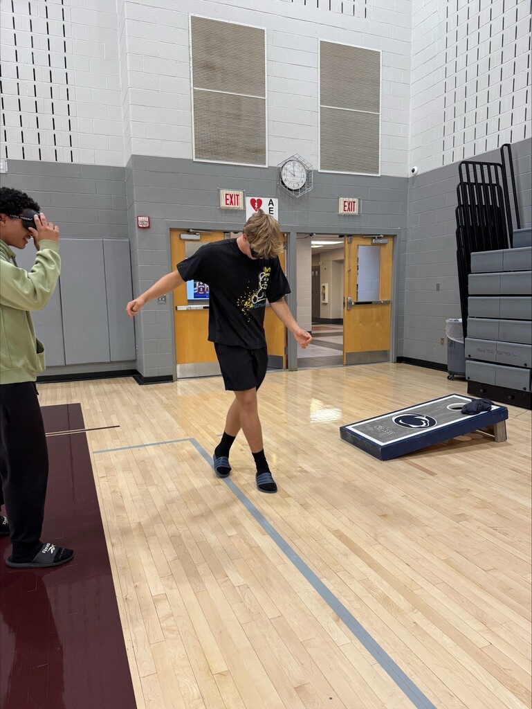 Student is using driving simulator goggles