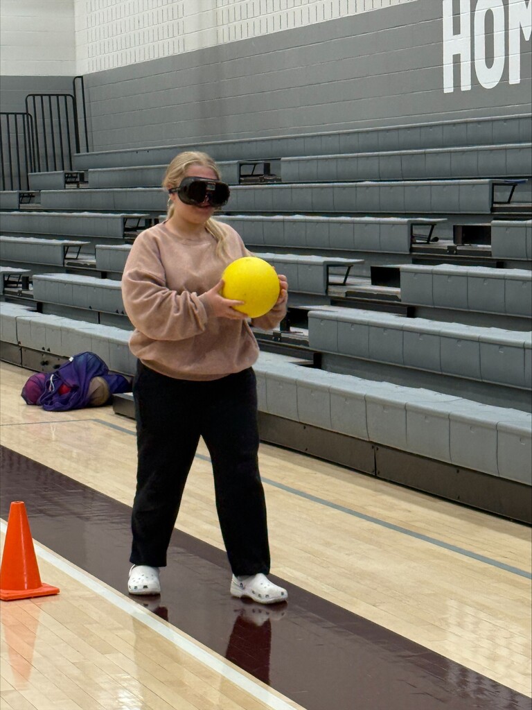 Student using driving simulator goggles