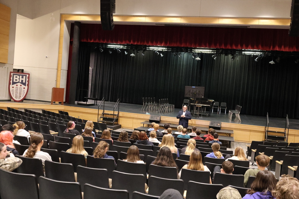 The President of Kutztown University is speaking to the students in the auditorium