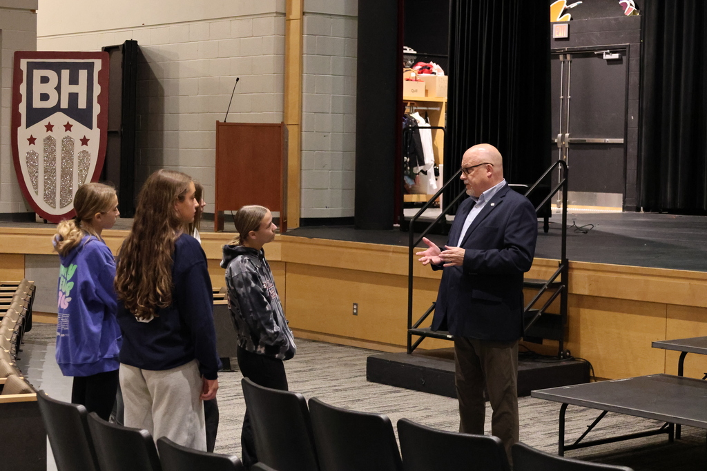 The Speaker  from Kutztown University is talking to a few students about college