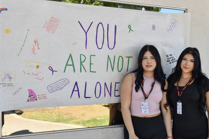 students pose for picture at mental health fair