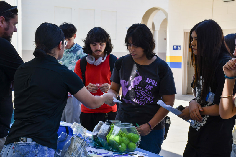 students pose for picture at mental health fair