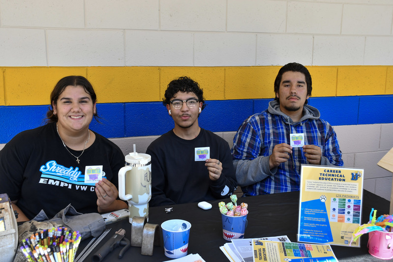 students pose for picture at mental health fair