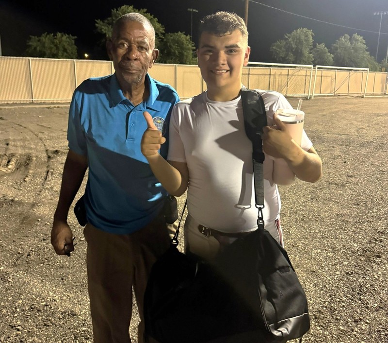 Staff James Haley poses for photo with Calexico high school student