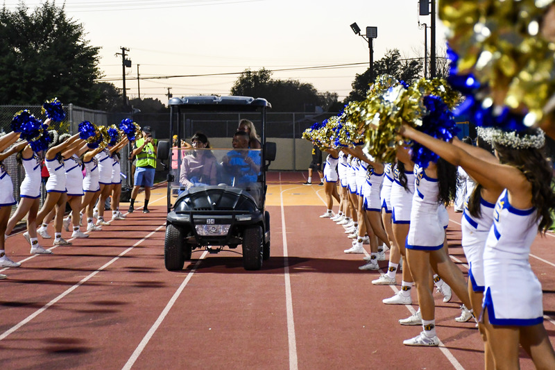Cheerleaders cheer during football game