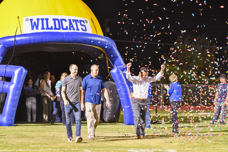 hall of fame inductee walk onto warne field during half time celebration
