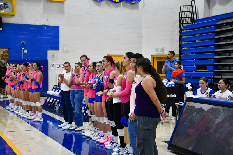Lopez family stand  alongside Brawley and imperial volleyball team.