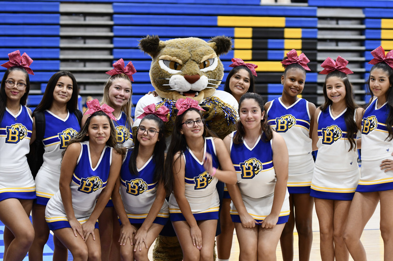 Willy the wildcat poses with Brawley Junior varsity cheer squad