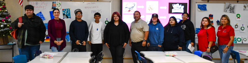 Mrs. Wells' students pose next to eachother for photo.