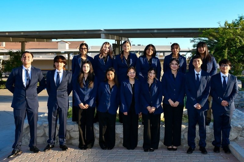 Migrant education students pose for group photo.