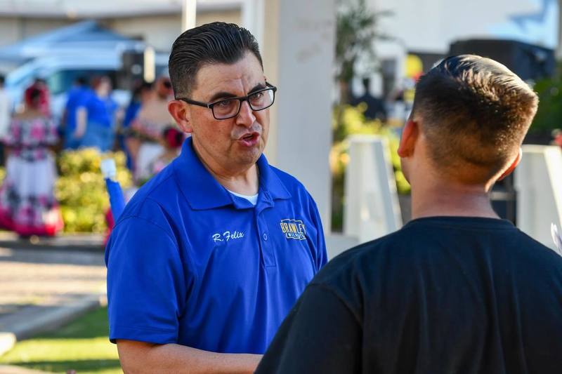 Counselor speaks to student at event