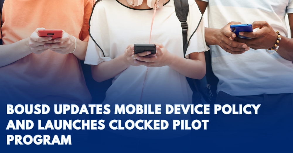 students holding their mobile devices