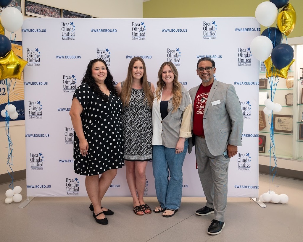 a group photo featuring Arovista's teacher of the year and employee of the year with Mr. Barrientos