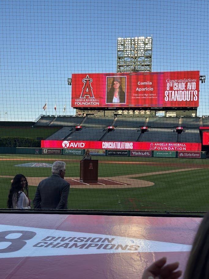 a screen at Angel Stadium displays Camila's photo and name