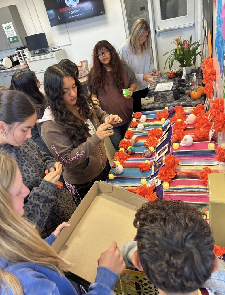 Brea Junior High Dual Language Program students decorate an ofrenda