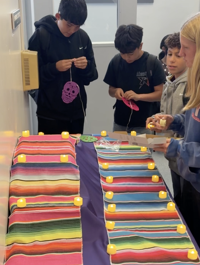 Brea Junior High Dual Language Program students decorate an ofrenda