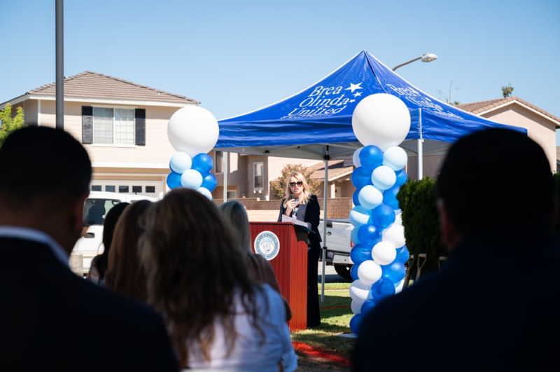 Photo of Superintendent Leon speaking from podium