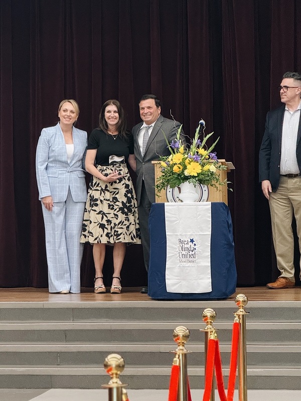 Superintendent Leon, Mrs. Rivera, Trustee Ruiz, Dr. Johnson
