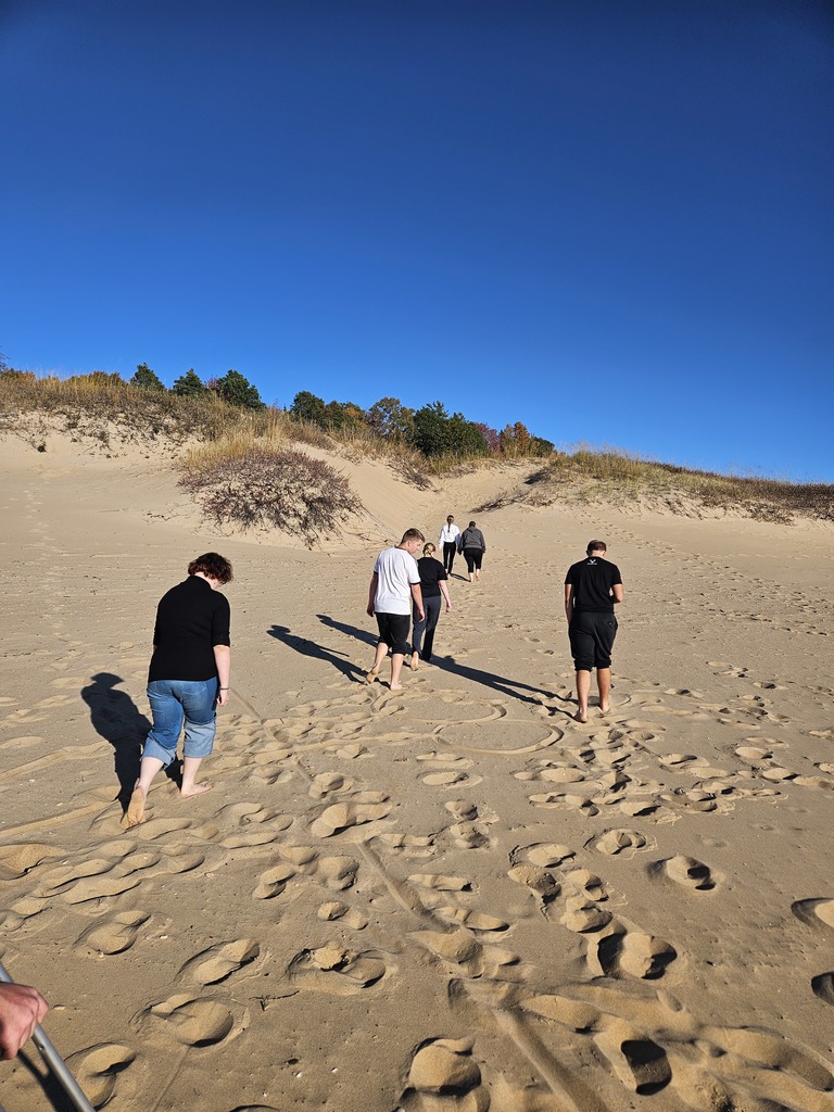 Climbing the sand dunes.