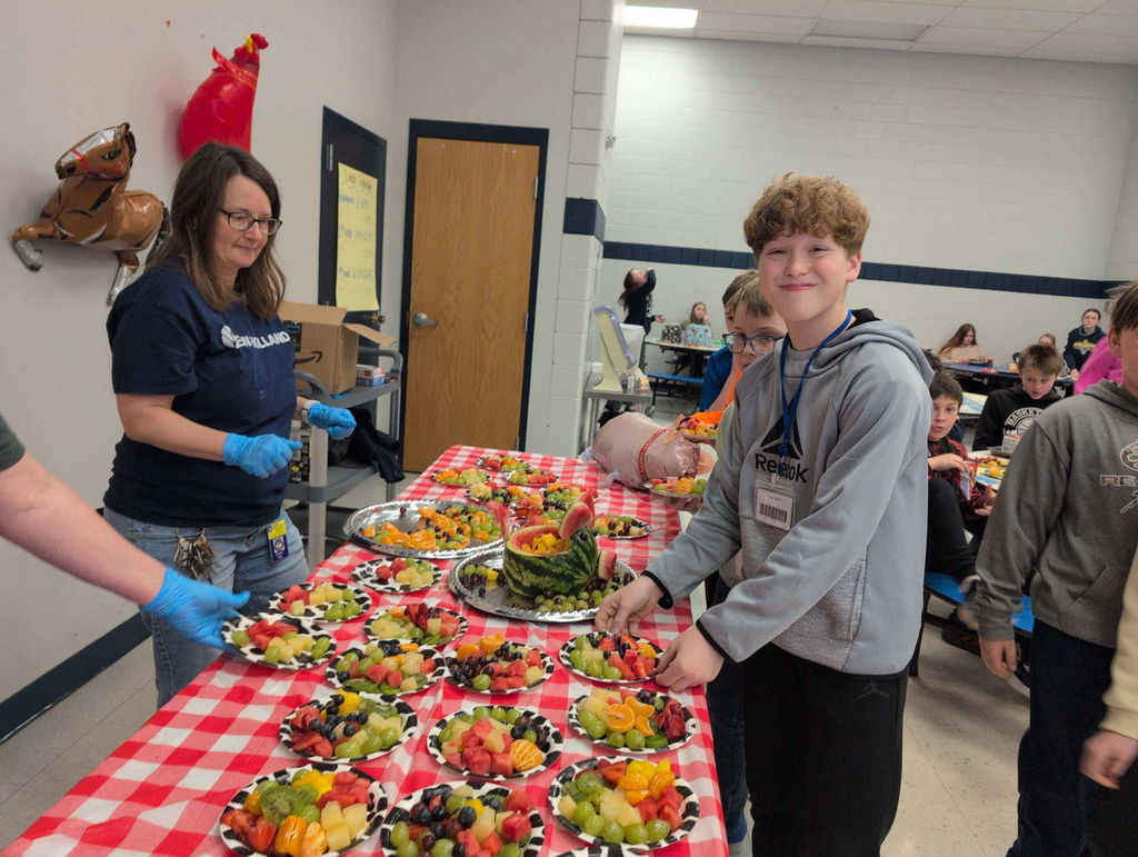 5th graders enjoying their fruit