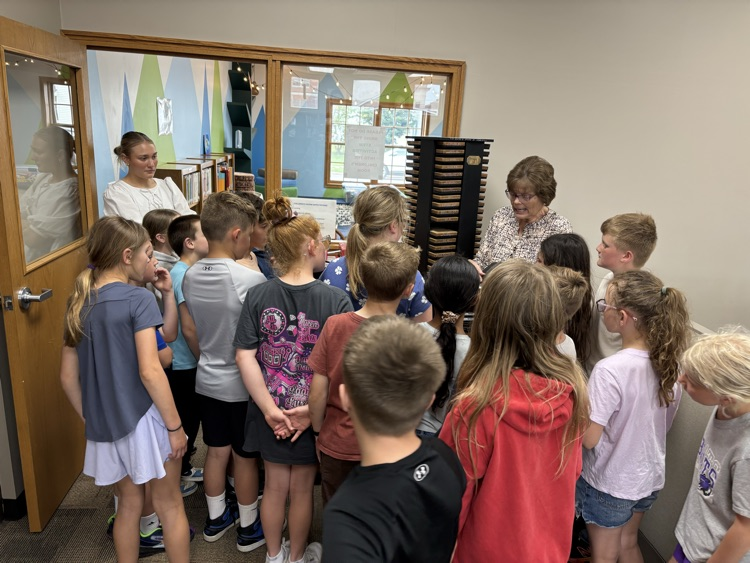 Mrs.  Diane, teaching them about the Ellis machine