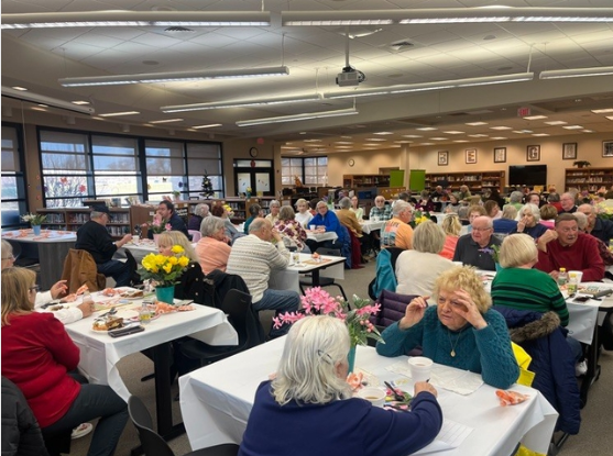 Senior Citizens luncheon at Oak Forest High School on March 18, 2025. Senior citizens sitting down enjoying breakfast. 