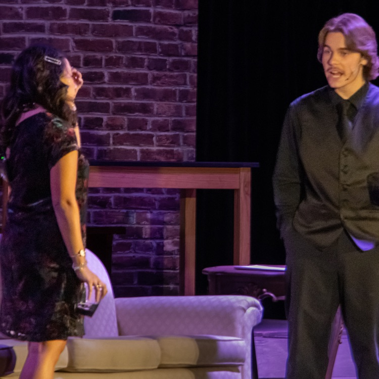 A man having an emotional conversation with his wife